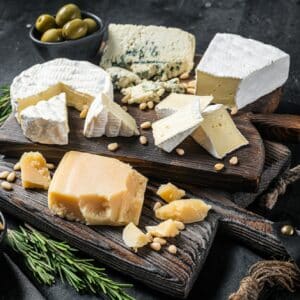 Delicious Cheese board. Assortment of cheese, camembert, brie, Gorgonzola, parmesan, olives